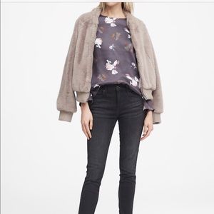 A loose light gray floral printed blouse